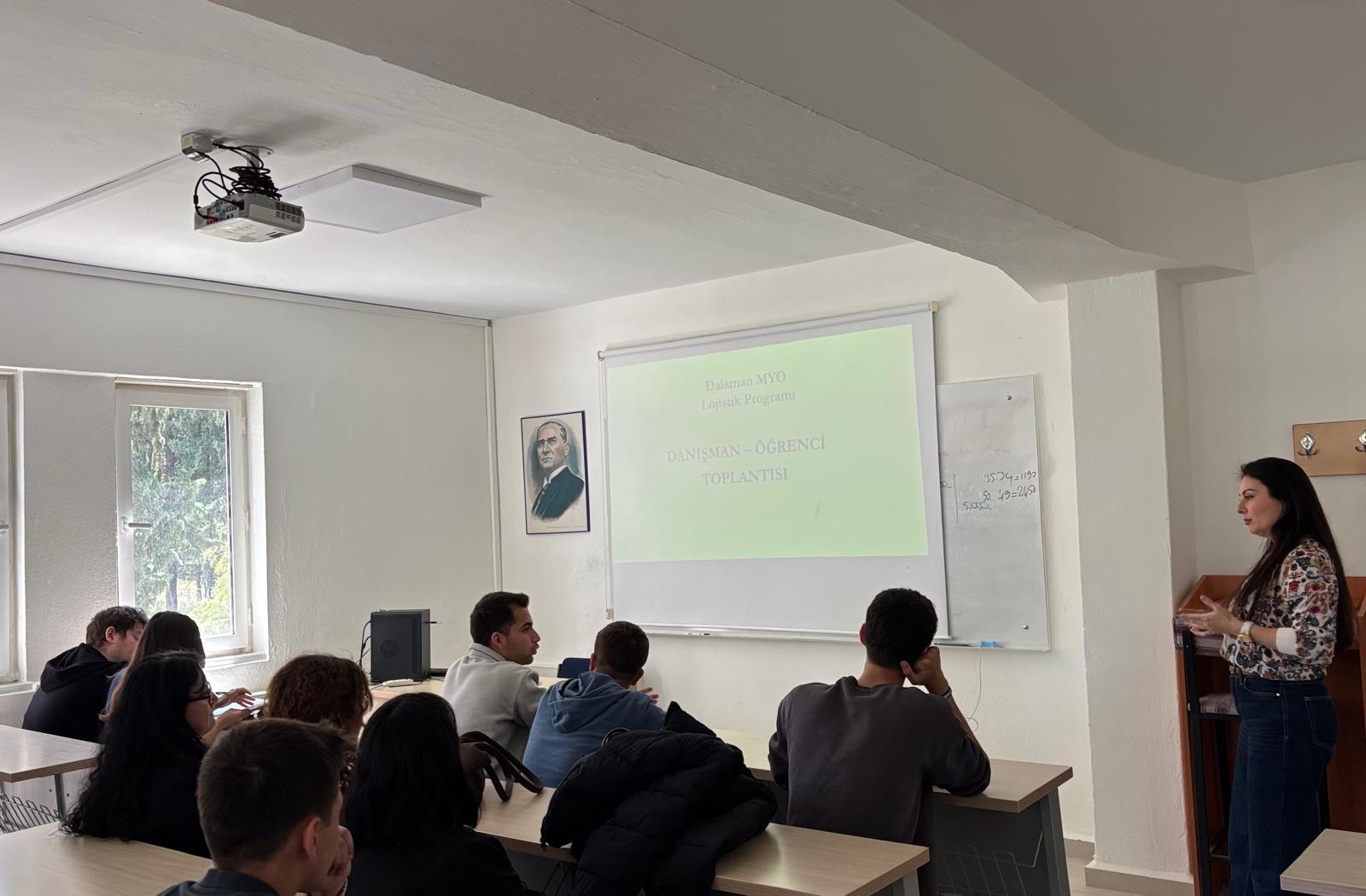 At the accreditation meeting held in a classroom, the instructor conducts an information and evaluation session with students.